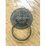 An antique Chinese bronze door handle, diameter 9.5 cm, total drop from top to bottom 14 cm.
