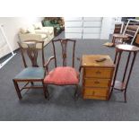 An antique inlaid mahogany armchair (af) together with a further antique mahogany dining chair,