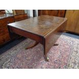 A Victorian mahogany flap sided pedestal dining table