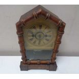 A late nineteenth century German pine cased fifteen day mantel clock