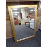 A contemporary gilt and silvered framed overmantel mirror