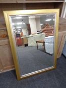 A contemporary gilt and silvered framed overmantel mirror