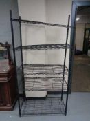 A set of wire metal open shelves, height 184 cm, width 92 cm and depth 46 cm.