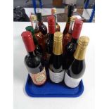 A tray of twelve bottles of alcohol and alcohol free mulled wines, apple juice,