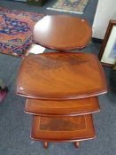 An inlaid mahogany nest of three tables together with pedestal wine table