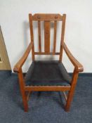 An Edwardian oak carver armchair