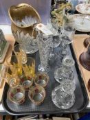 A tray of glass ware, pressed glass water jug, wine glasses,