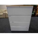 A four drawer metal document cabinet with oak effect top with no key