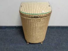 A golden Lloyd loom linen basket