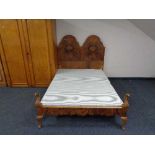 An early twentieth century burr walnut bed frame. Height 140 cm, length 207 cm x width 138 cm.