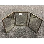 An early twentieth century brass three way table topped mirror, height 21 cm.