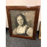 A monochrome print in a mahogany framed depicting a woman