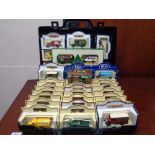 A plastic case of boxed die cast cars - Hamley's delivery vehicles,