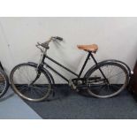 A vintage bicycle with leather saddle