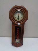 A mahogany cased eight day wall clock bearing Texaco Oil and Gas advertising
