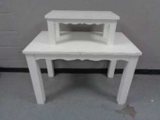 A painted two tier shop display table