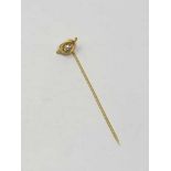 A high carat gold pin set with a good quality diamond approximately 0.25ct, 1.8g.