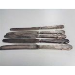 Five silver handled butter knives