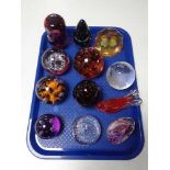 A tray of glass paperweights