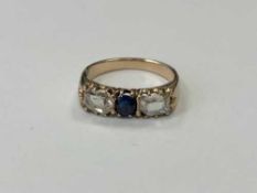 A three stone diamond and sapphire ring, approx.