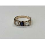 A three stone diamond and sapphire ring, approx.