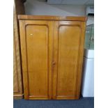A Victorian oak double door wardrobe