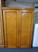 A Victorian oak double door wardrobe