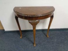 A walnut Queen Anne style D-shaped table