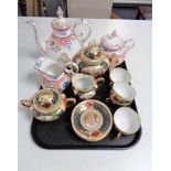 A tray of continental gilded eleven piece tea service, antique floral patterned teapot,