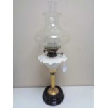A Victorian brass and pottery Hinks number 1 oil lamp with clear glass chimney and shade