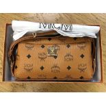 A lady's MCM hand bag in box with receipt and dust cover