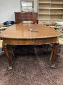 A Victorian mahogany wind out table with leaf and handle on claw & ball feet