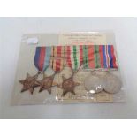 A set of five WW II medals on ribbons