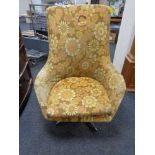 A mid century floral upholstered armchair in chrome metal base CONDITION REPORT: