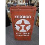 A mid century metal work shop cabinet fitted with shelves with Texaco hand painted decoration