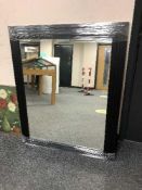 A black framed contemporary mirror