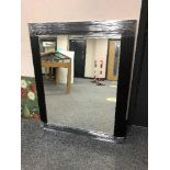 A black framed contemporary mirror