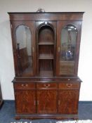 A reproduction mahogany display cabinet