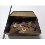 A vintage tin of coins,