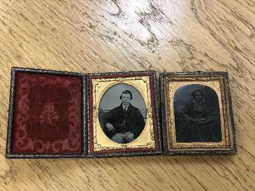 A Victorian folding daguerreotype tooled leather frame and one other.