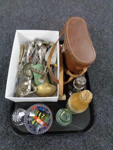 A tray of cased binoculars, glass paperweights, plated cutlery, sugar sifter,