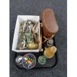 A tray of cased binoculars, glass paperweights, plated cutlery, sugar sifter,