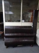 A brown leather 4'6 sleigh bed