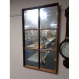 A teak twentieth century sectional mirror