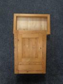 A pine counter top display cabinet and a pine wall cabinet