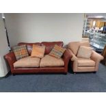 A leather and cloth two seater settee with scatter cushions together with an armchair