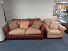 A leather and cloth two seater settee with scatter cushions together with an armchair