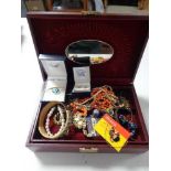 A leather jewellery box of necklaces, earrings,