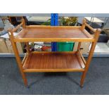 A twentieth century teak two tier trolley