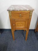 An antique French oak marble topped pot cupboard with gilt metal mounts